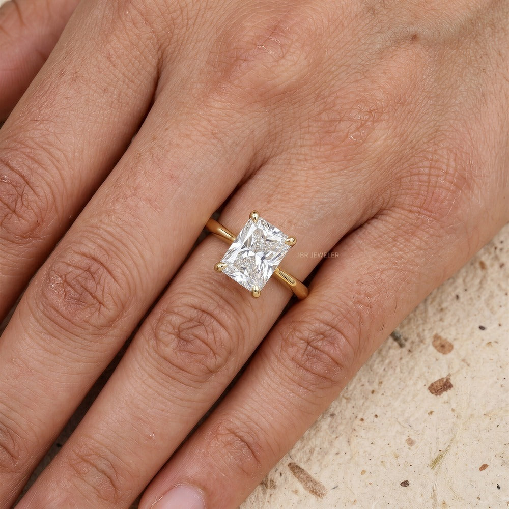 Radiant moissanite solitaire ring worn on hand