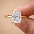 Radiant moissanite solitaire ring worn on hand