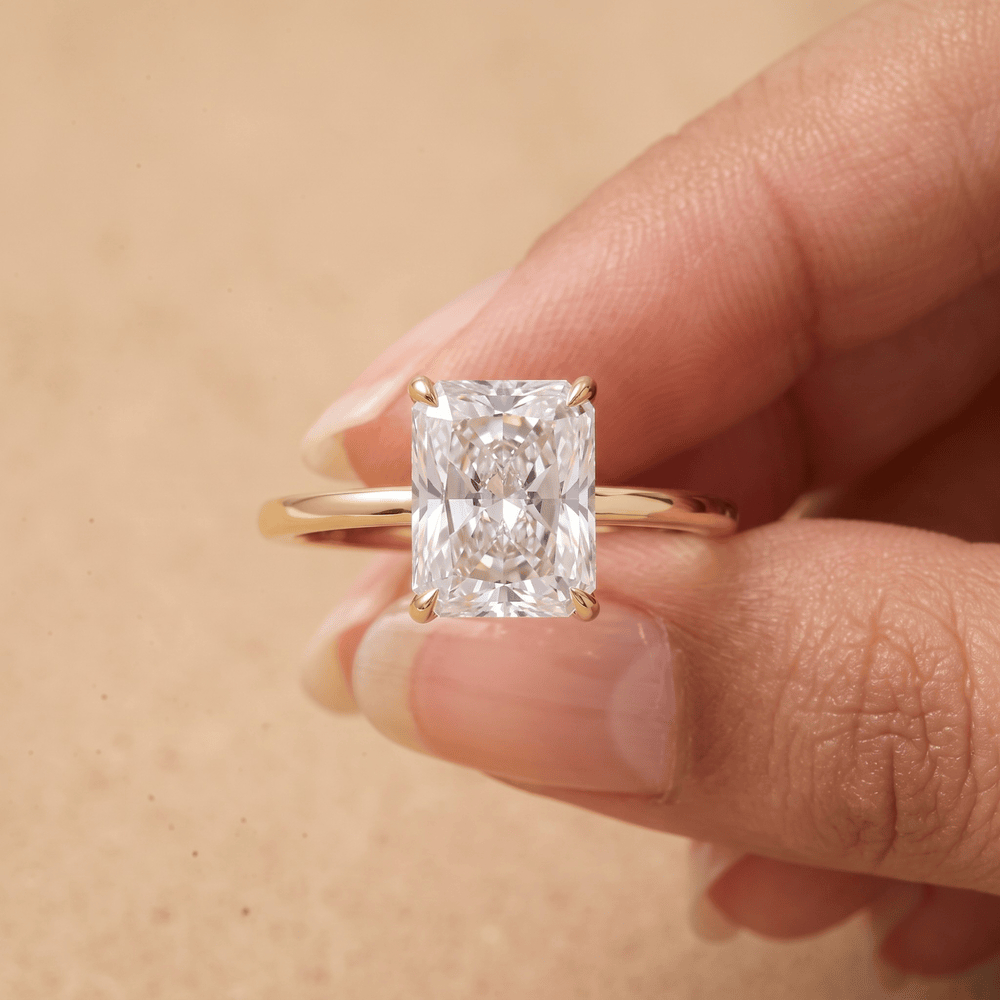 Petal radiant solitaire ring on model's hand