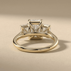 14K gold three stone engagement ring with radiant center diamond