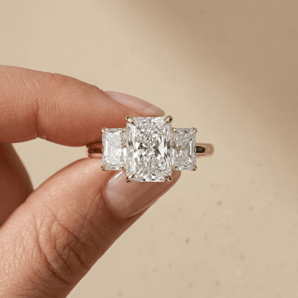 Radiant three stone lab diamond engagement ring in yellow gold