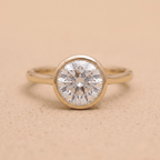 Round bezel set moissanite solitaire proposal ring front view