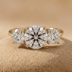 Round cut lab grown diamond three stone engagement ring