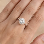 Moissanite engagement ring on hand