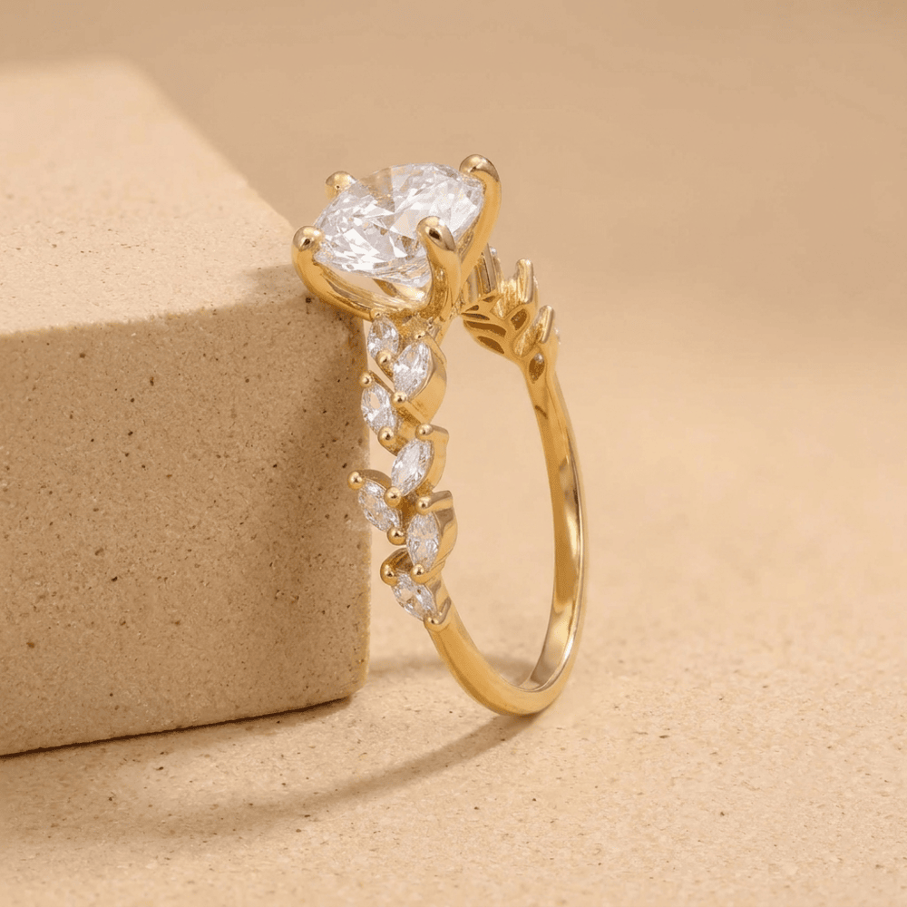 Dainty round lab diamond ring with marquise side stones