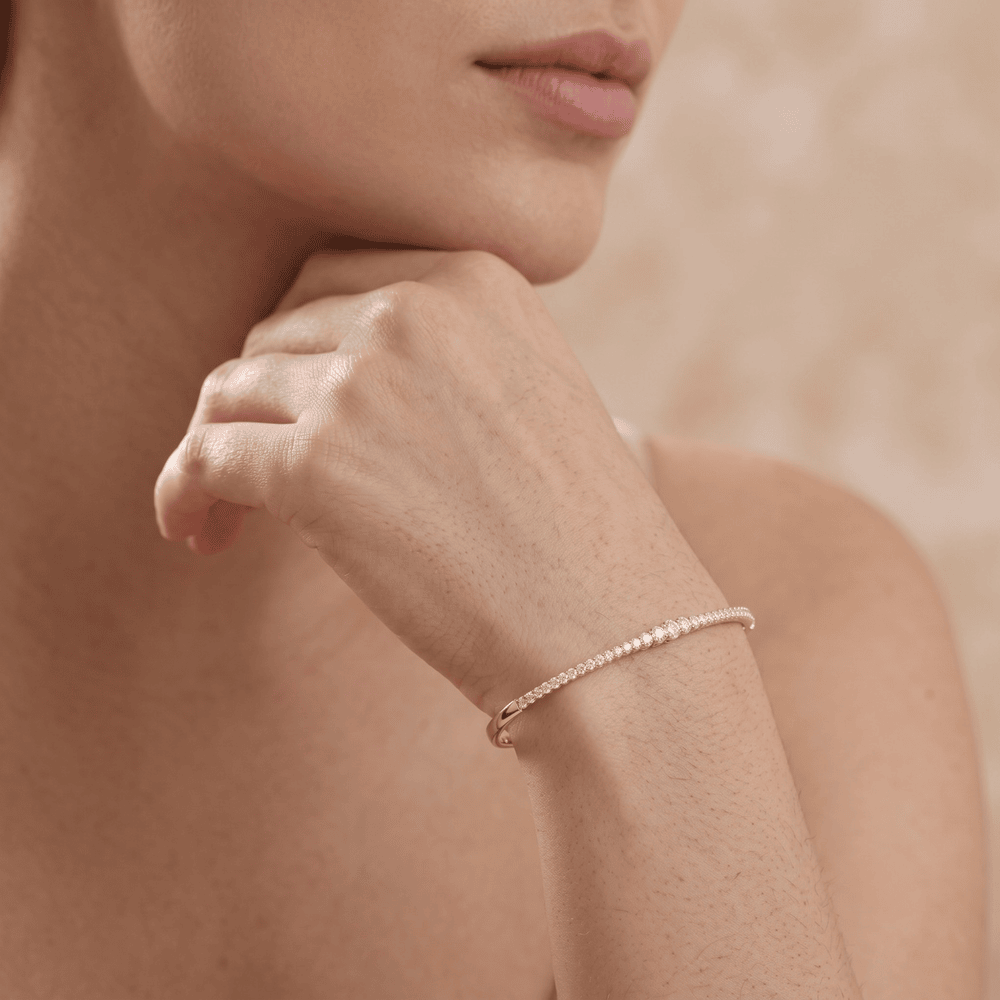 Minimalist round diamond bangle in yellow gold