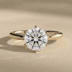 Round lab grown diamond engagement ring with sweeping band