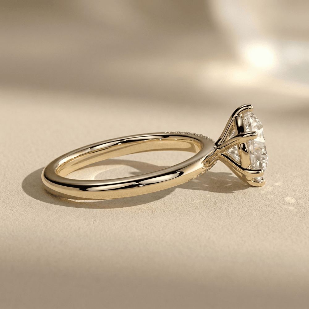 Round diamond engagement ring with pavé band