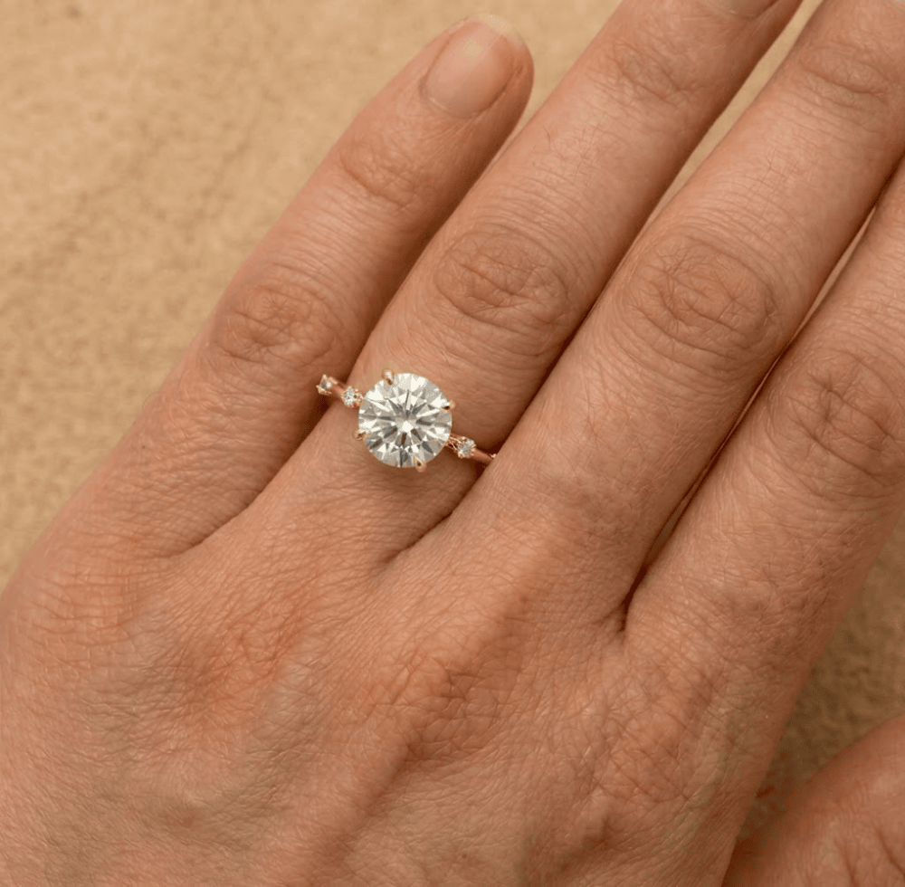 Delicate 14K gold ring with sparkling round moissanite