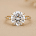 Round moissanite engagement ring in 14K yellow gold thin band