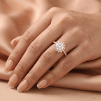 Shared prong halo ring on model's hand