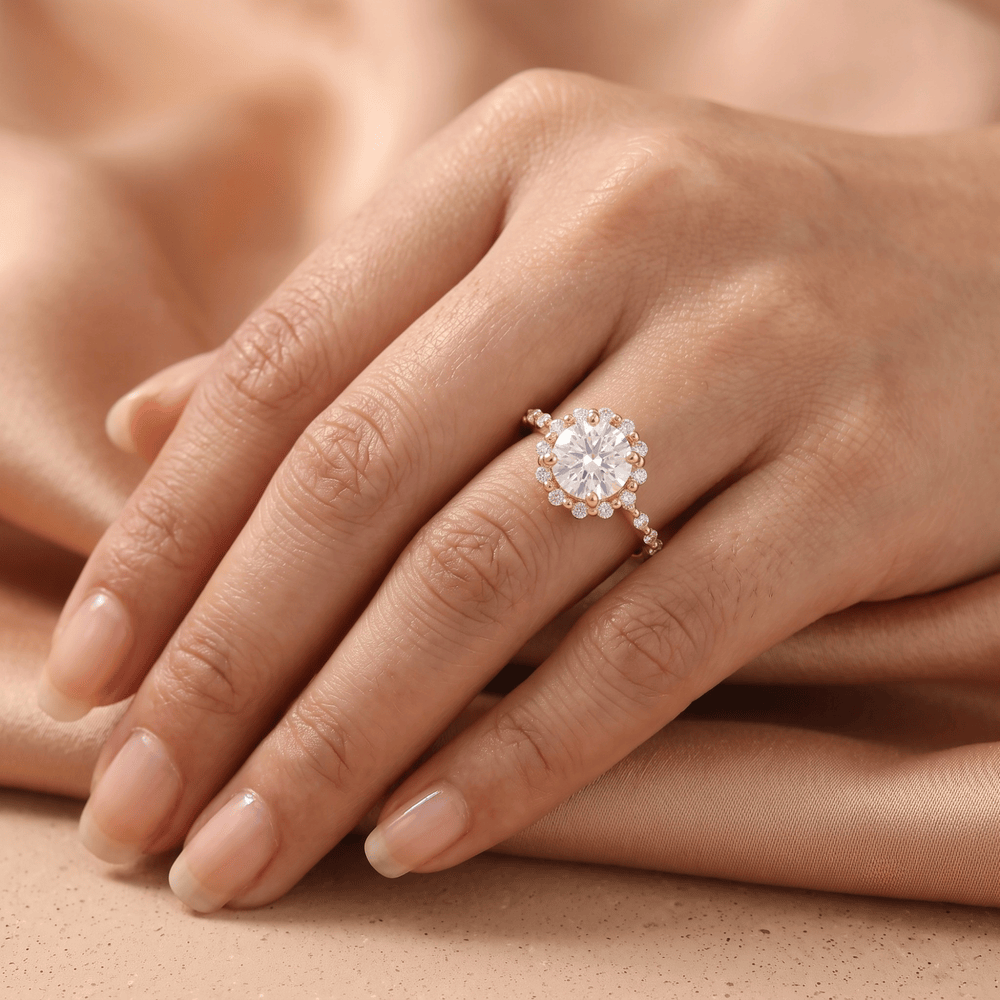 Shared prong halo ring on model's hand