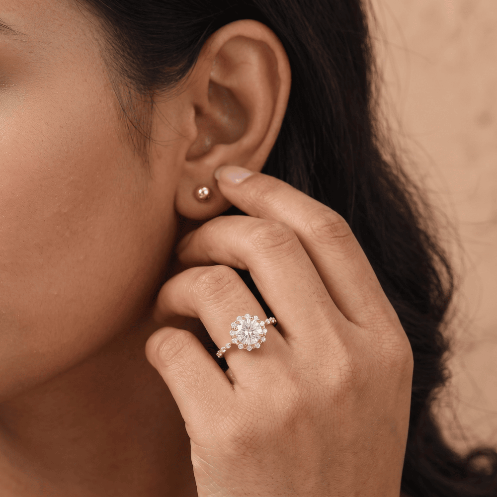 Round moissanite ring in 14K yellow gold setting