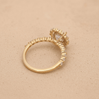 Round moissanite center stone in 14K gold halo setting