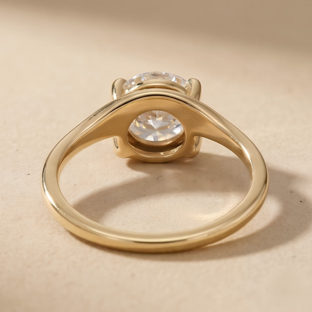 Round cut moissanite ring showcasing 14K gold curved band design