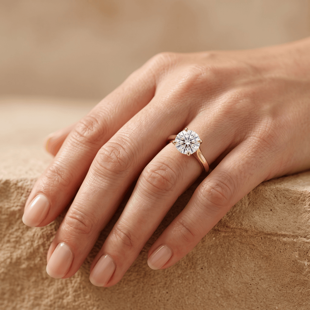 14K gold curved band ring on hand, round moissanite detail