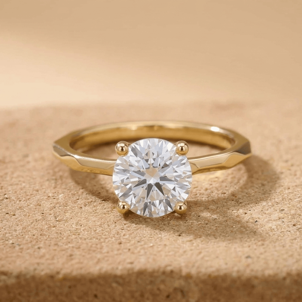 Round moissanite solitaire ring with 14K vintage band front view