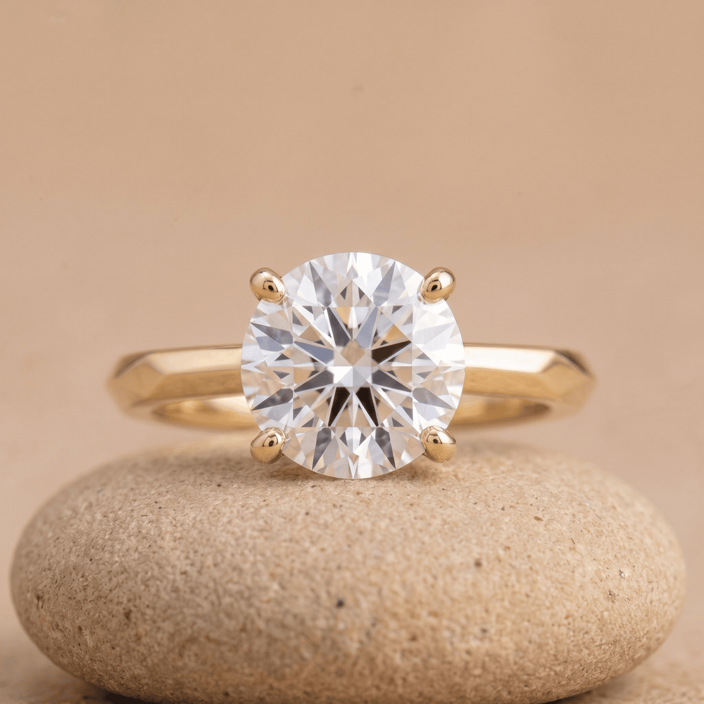 Round moissanite solitaire ring with 14K vintage band front view