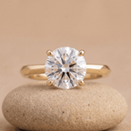 Round solitaire engagement ring in 14K gold