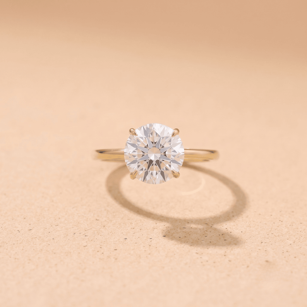 Couple promise rings round solitaire close-up