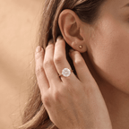 Round solitaire promise ring lifestyle photo outdoors