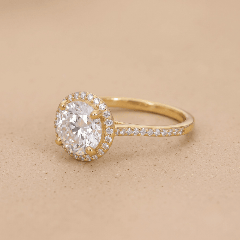 Side stone detail on moissanite halo engagement ring