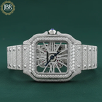 Luxury diamond-encrusted watch with intricate design on a green background, featuring the JBR Jewels logo.