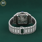 Luxury diamond-encrusted watch on a dark green background with JBR Jewels logo.