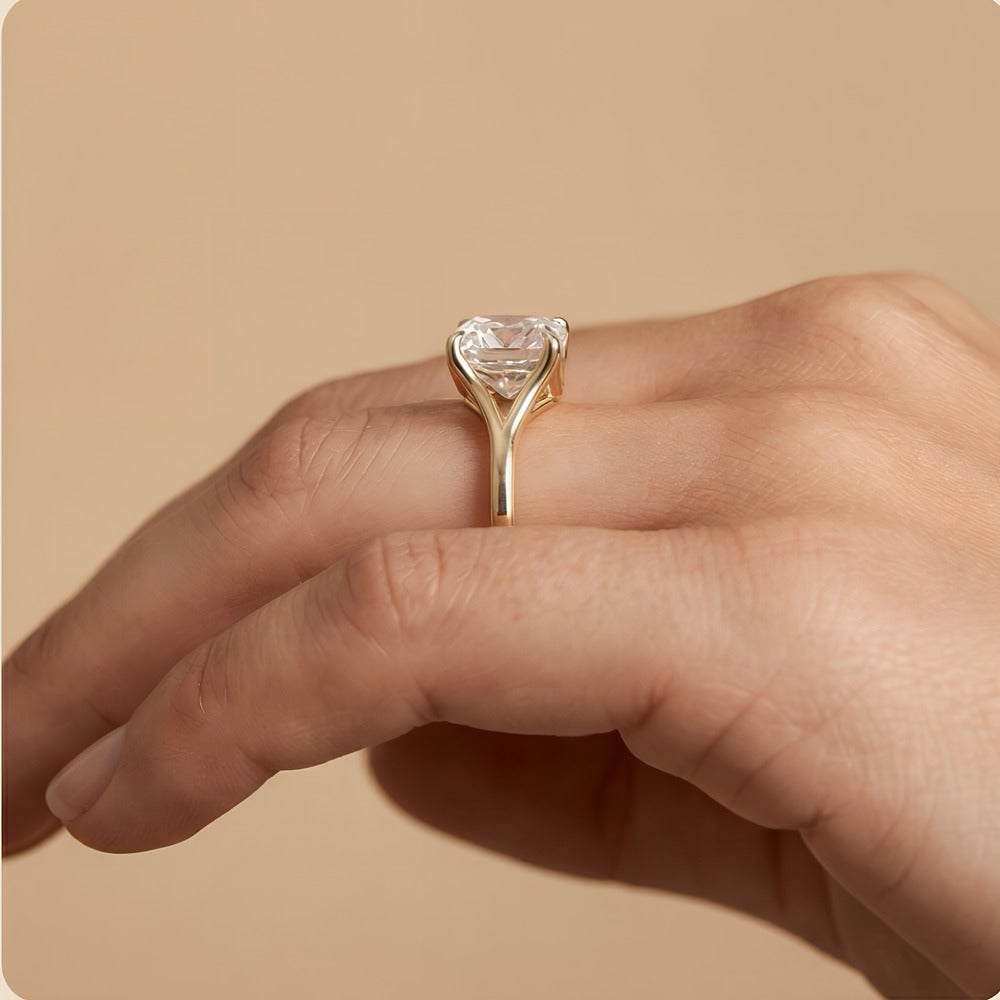 Ethical cushion moissanite ring on model's hand