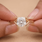 Ethical cushion moissanite ring on model's hand