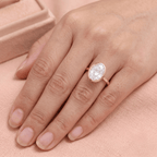 Solitaire bezel set oval diamond ring on hand