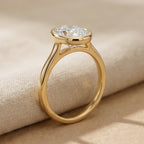 Oval solitaire bezel ring side profile view