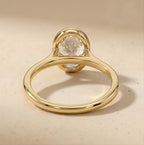 Solitaire bezel oval ring with matching wedding band
