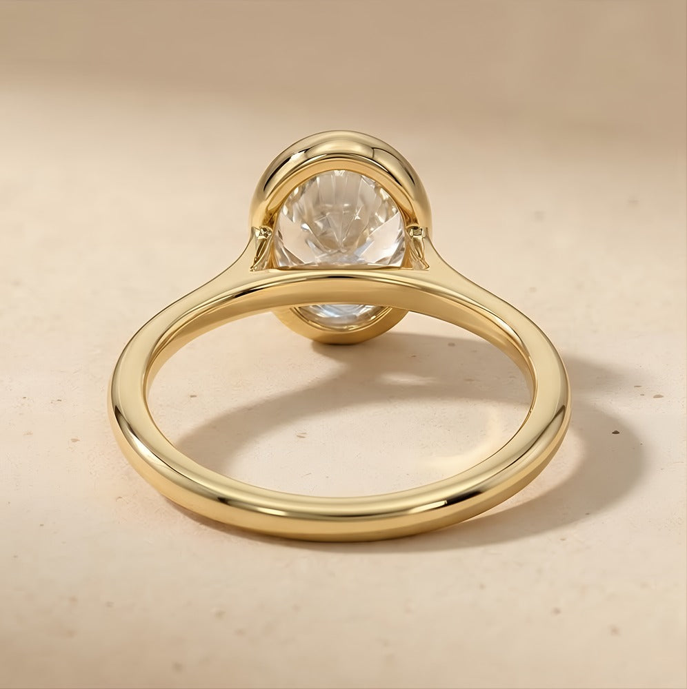 Solitaire bezel oval ring with matching wedding band