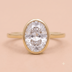 Oval solitaire bezel engagement ring front view