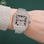 Luxury diamond-encrusted watch on a wrist with JBR Jewellers logo.
