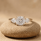 Three stone cushion moissanite engagement ring in yellow gold