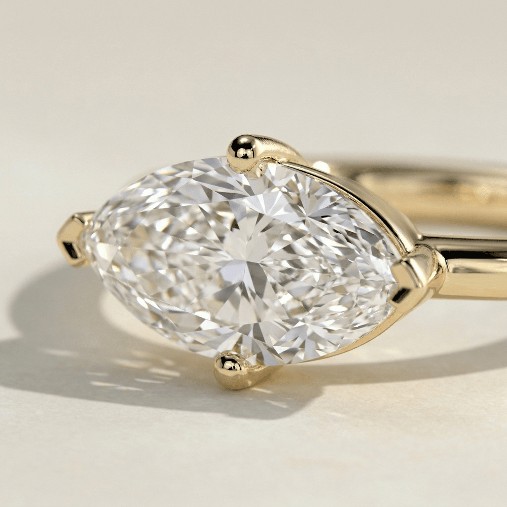 Solid 10K yellow gold east west moissanite ring close up