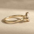 Dainty east west marquise engagement ring in yellow gold