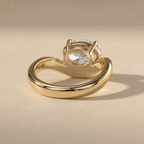 Modern oval moissanite ring with curved gold band