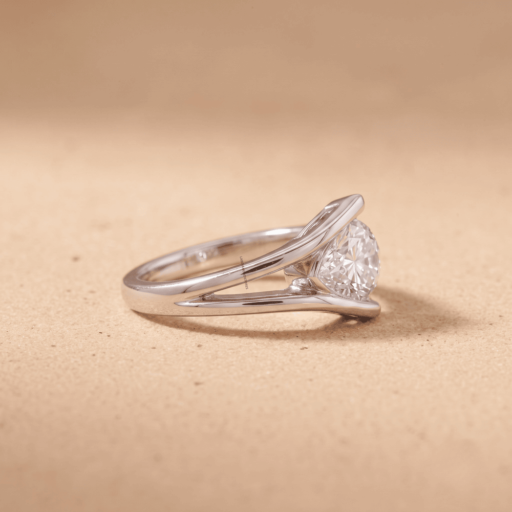 Pear Shaped Moissanite Solitaire Ring in White Gold side view