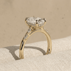 Elongated cushion solitaire ring with hidden halo