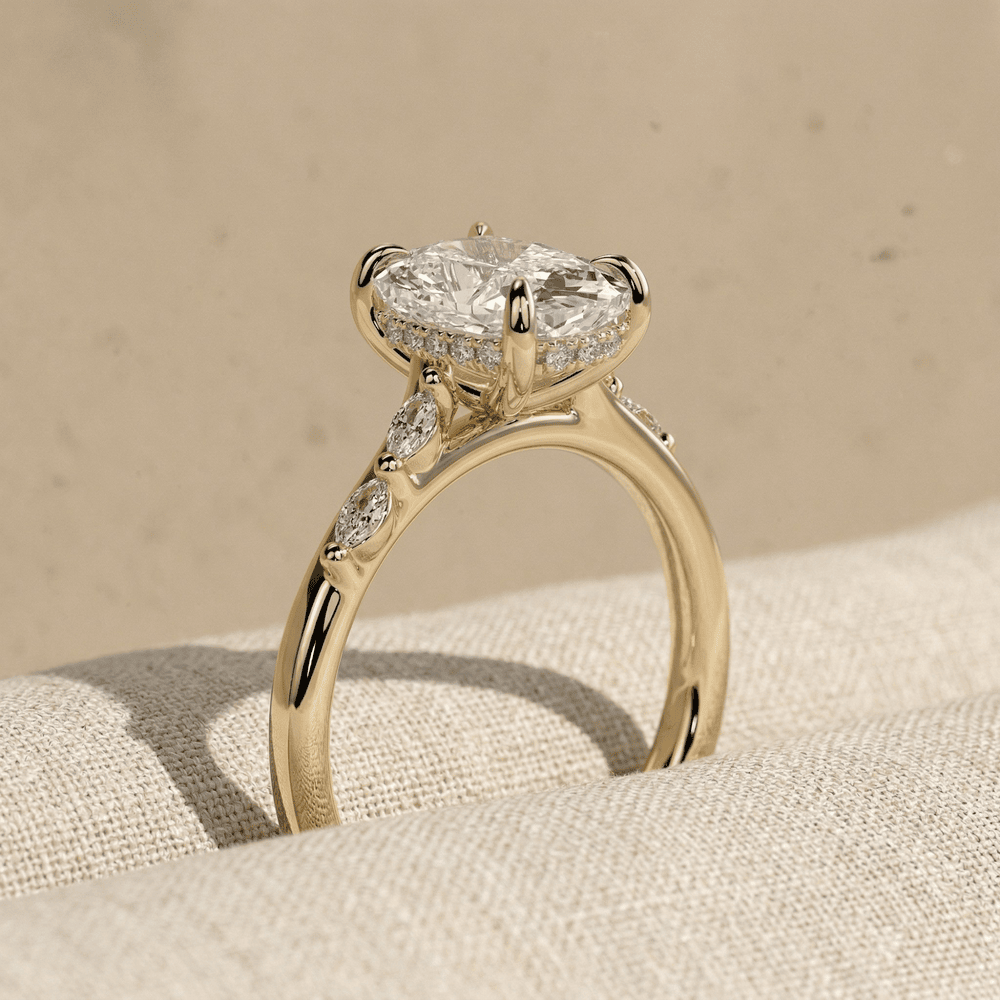 Elongated cushion solitaire ring with hidden halo