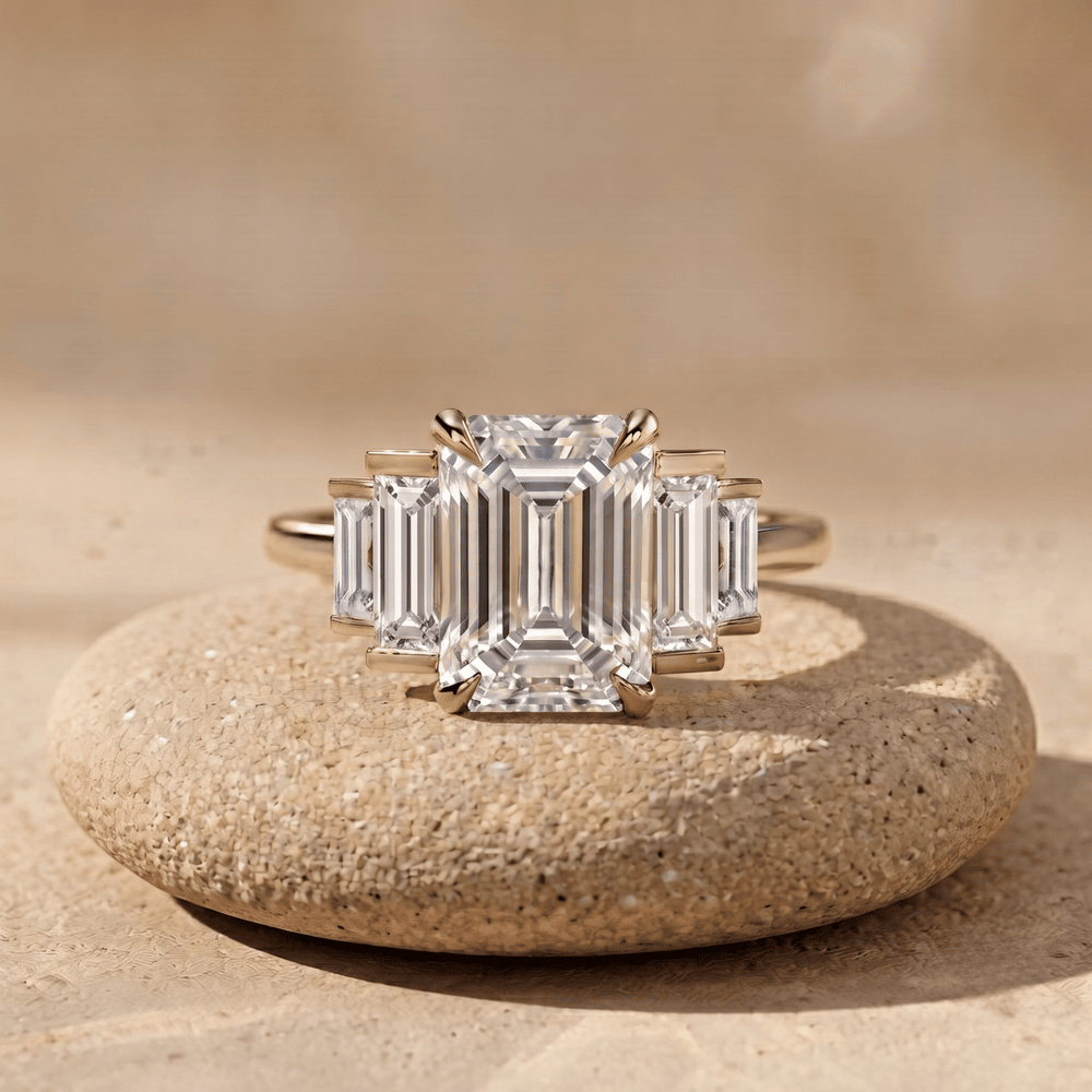 Emerald and baguette moissanite three stone promise ring