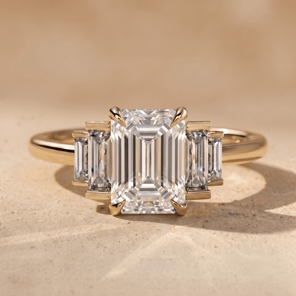Three stone emerald moissanite ring with baguette accents