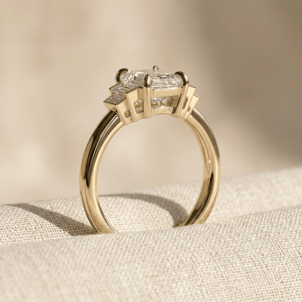 Emerald cut moissanite ring with tapered baguette side stones