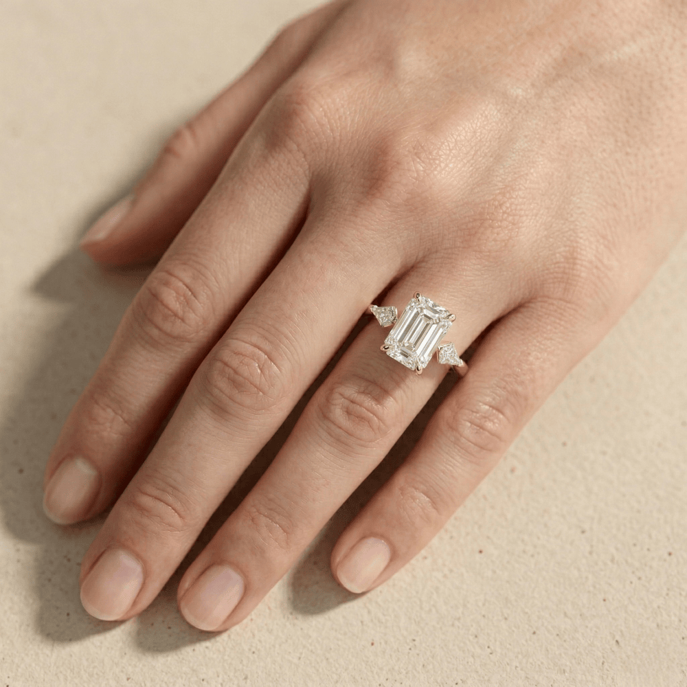 Emerald three stone engagement ring for a wedding proposal