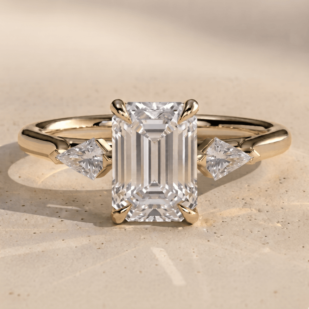 Emerald moissanite wedding ring with two side stones