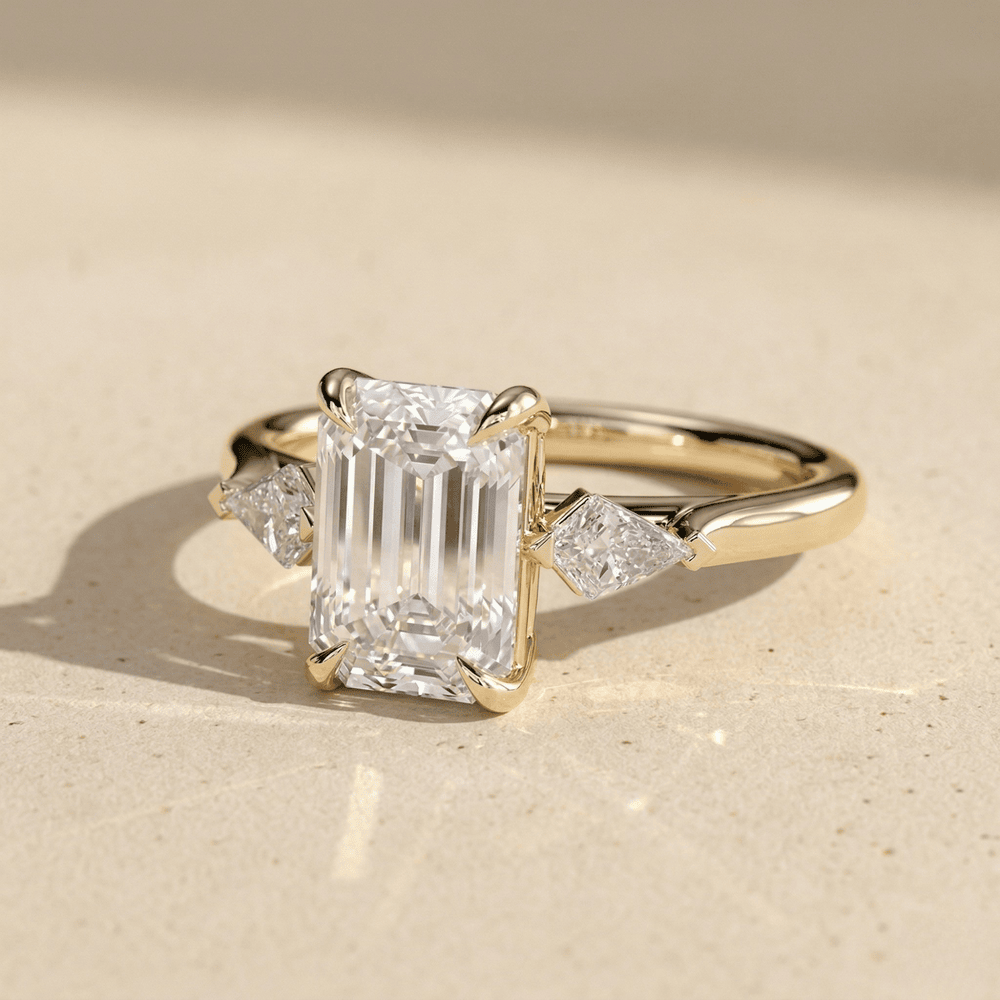 Emerald moissanite wedding ring with two side stones