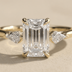 Emerald cut center moissanite ring with matching side stones